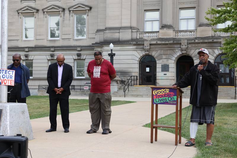 Pastor Lawrence Shepherd, of the BibleWay Christian Center in Kankakee, says a prayer during a "Good Trouble Lives On" rally held in Kankakee as part of a national day of peaceful protests on Thursday, July 17, 2025.