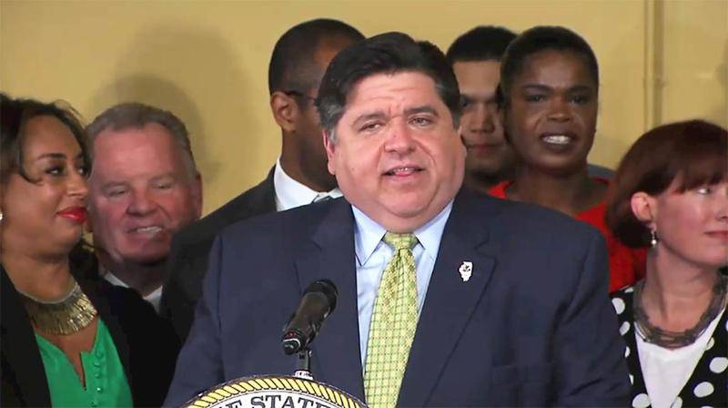 Gov. JB Pritzker speaks before signing a bill legalizing adult use of recreational marijuana in Illinois during a ceremony Tuesday at the Sankofa Cultural Arts and Business Center in Chicago.