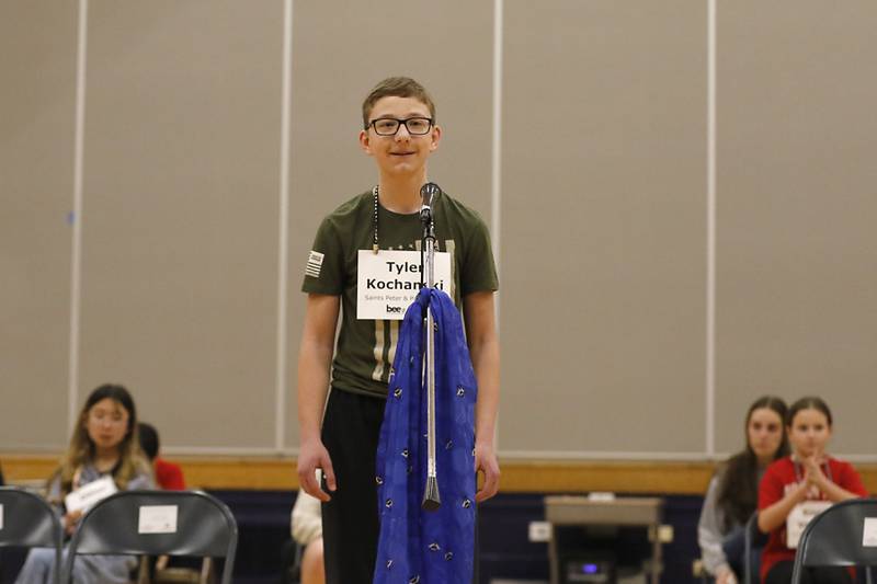 Tyler Kochanski, a student at Saints Peter and Paul Catholic School, smiles as he spells “commander” to defeat Keegan Schultz, a student at Marengo Community Middle School, to win the McHenry County Regional Office of Education’s 2025 Spelling Bee on Wednesday, March 19, 2025, at Bernotas Middle School in Crystal Lake.
