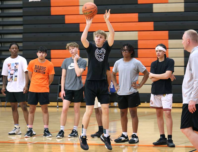 DeKalb’s Sean Reynolds shoots a three as his teammates look on during practice Monday, June 19, 2023, at DeKalb High School.