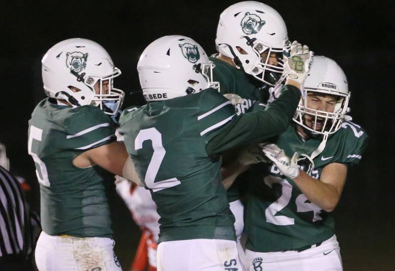 St. Bede players (from left) Halden Hueneburg, Carson Riva, Demian Baker and Phillip Gray celebrate in the end zone after Gray caught a touchdown against Ottawa on Friday, Oct. 25, 2024 at St. Bede Academy.