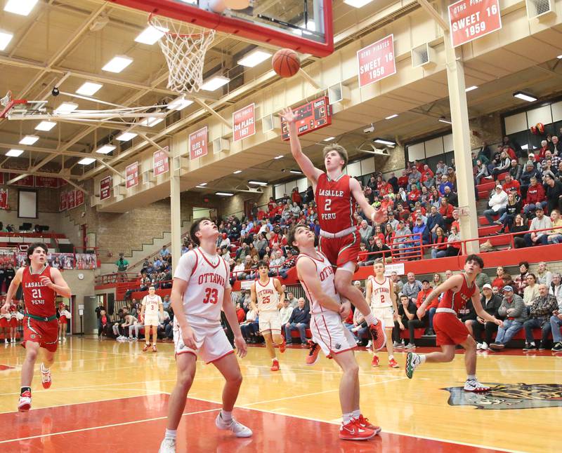 L-P's Seth Adams scores on a jump shot over Ottawa's Conner Price in Kingman Gymnasium on Friday, Feb. 10, 2023 at Ottawa High School.