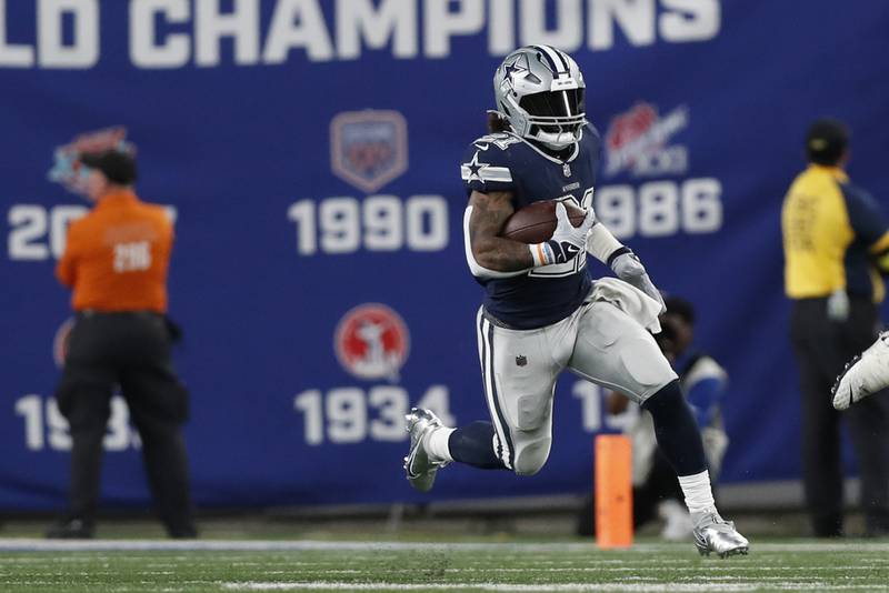 Dallas Cowboys running back Ezekiel Elliott (21) runs the ball up the field during an NFL football game against the New York Giants, Monday, Sept. 26, 2022, in East Rutherford, N.J. (AP Photo/Steve Luciano)