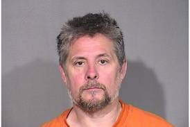 Man allegedly threatened to shoot at people at Island Lake bar, hit patron with shotgun