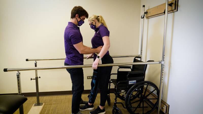 Students in McHenry County College's physical therapy assistant program practice techniques they learn in class.