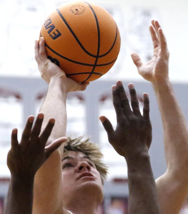 Prairie Ridge's Maddon McKim shoots the ball over Illinois Math & Science Academy's Lota Onwuameze during a IHSA Class 3A Burlington Central Regional quarterfinal boys basketball game on Monday, feb23, 20256, at Prairie Ridge High School in Crystal Lake.
