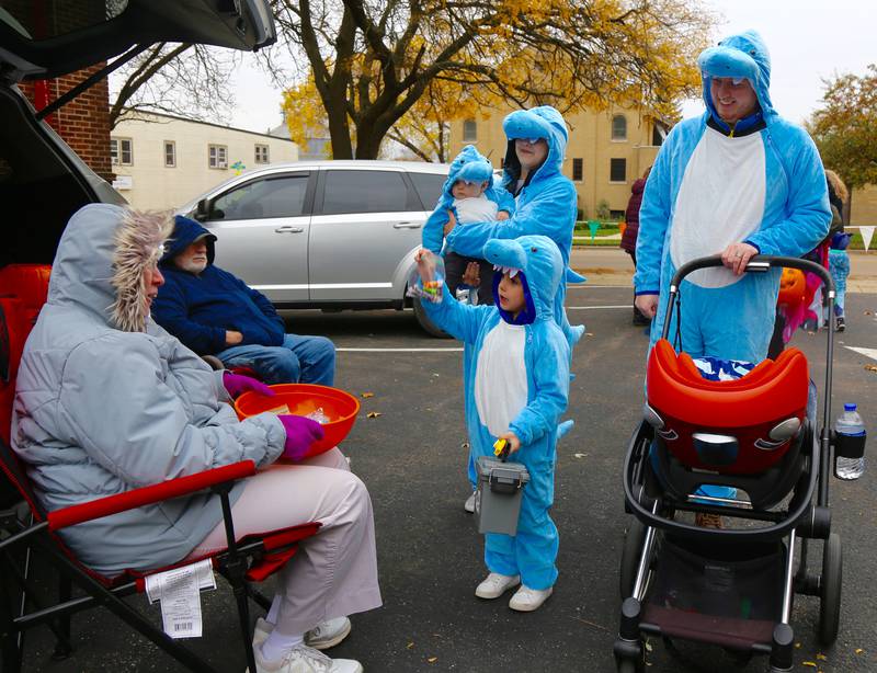 The Humenik Family of Campton Hills dresses as a school of sharks at the 9th Annual Trunk or Treat at the Elburn Community Congregational Church on Sunday, Oct. 29, 2023 in Elburn.