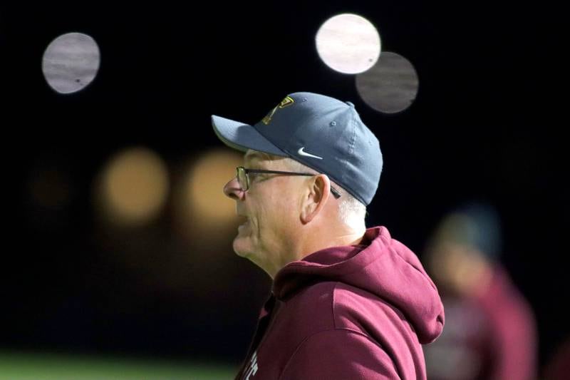 Richmond-Burton’s Head Coach Mike Noll guides the Rockets as they build a first-half lead in IHSA football Class 3A second-round playoff action at Bob Stewart Field on the campus of Aurora Central Catholic High School in Aurora on Friday, November 7, 2025.