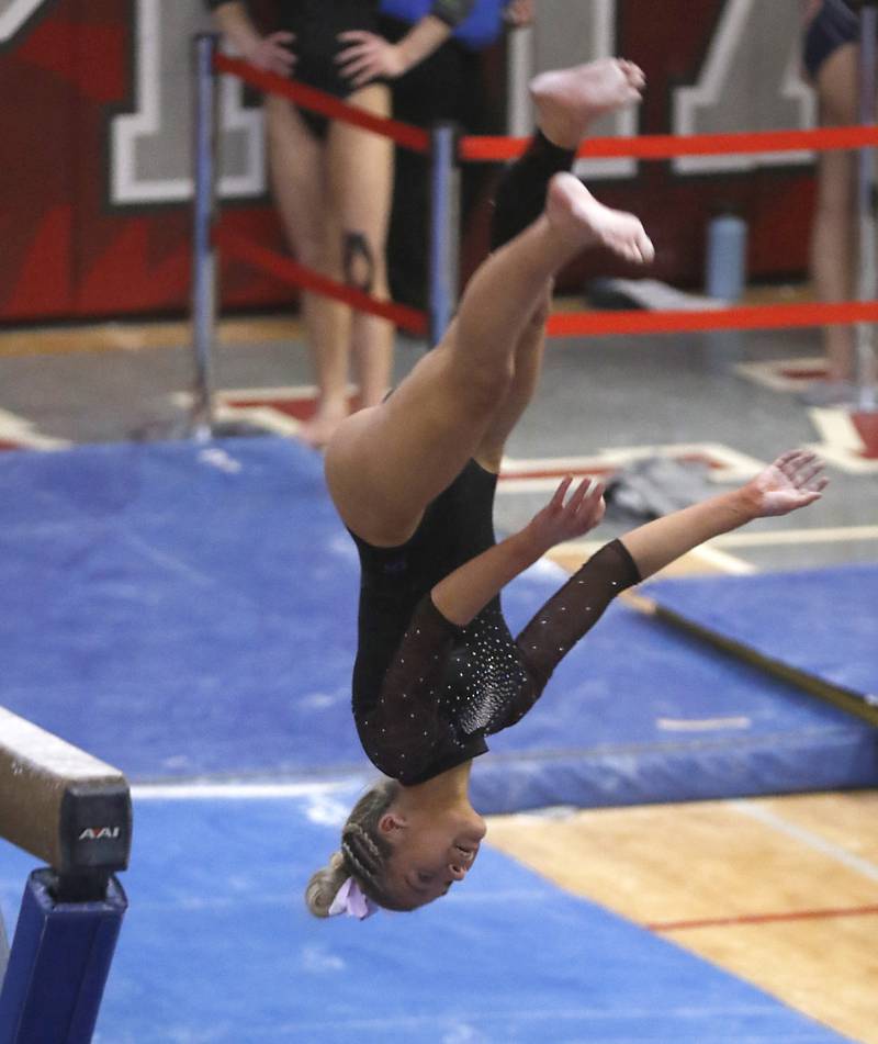 Wheaton Warrenville South’s Jordon Wach competes in the preliminary round of the balance beam Friday, Feb. 17, 2023, during the IHSA Girls State Final Gymnastics Meet at Palatine High School.