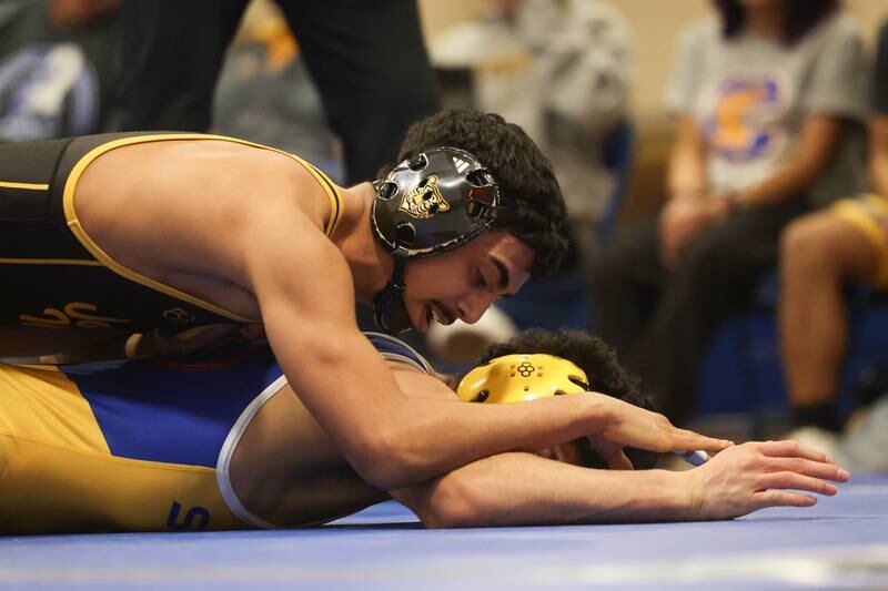 Joliet West’s Adrian Hernandez works over Joliet Central’s Isaiah Kan in the 138-pound weight match at Joliet Central on Friday, Jan 31, 2025.