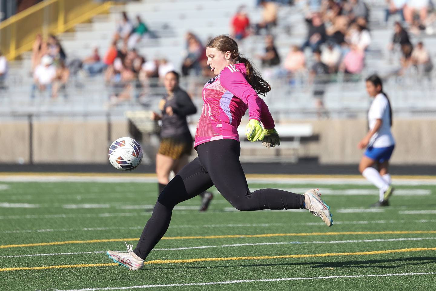 Joliet Central’s Cali Judd puts the ball in play against Joliet West on Tuesday, April 30, 2024.