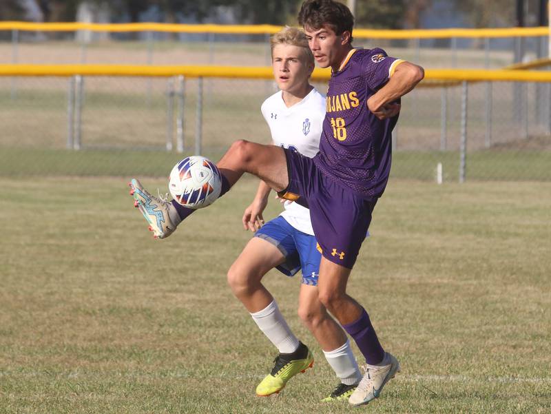 Mendota's Cameron Escatel kicks the ball away from Princeton's Andrew Stocking during the Class 1A Regional final game on Tuesday, Oct. 22, 2024 at Serena High School.