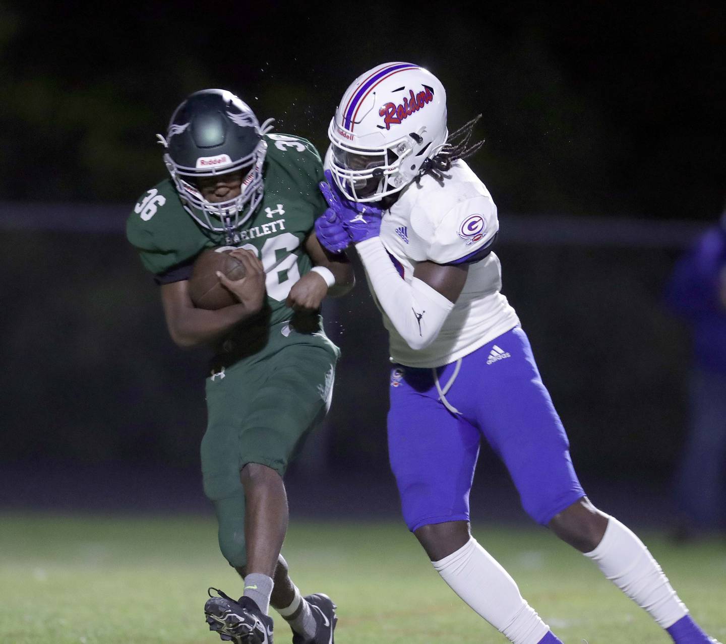 Glenbard South's Easton Lange (10) brings down Bartlett's (36) Friday September 23, 2022 in Bartlett.