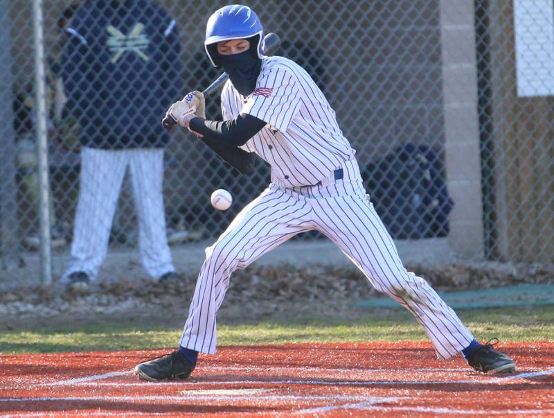 Newark's Austin Reibel watches strike three cross the plate while playing Marquette on Monday, March 23, 2026 at Newark High School.