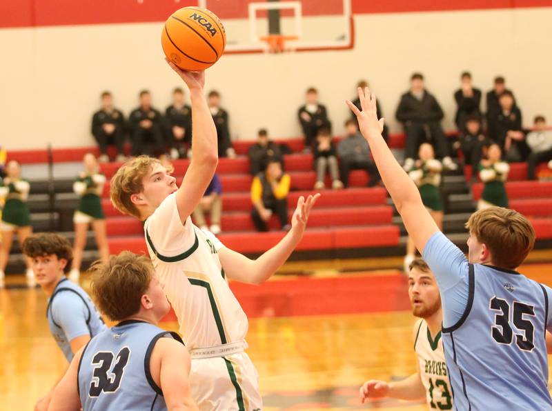 St. Bede's Kaden Newman eyes the hoop as Bureau Valley's Elijah Endress and Brad Schoff defend during the 50th annual Colmone Classic on Thursday, Dec. 12, 2024 at Hall High School.