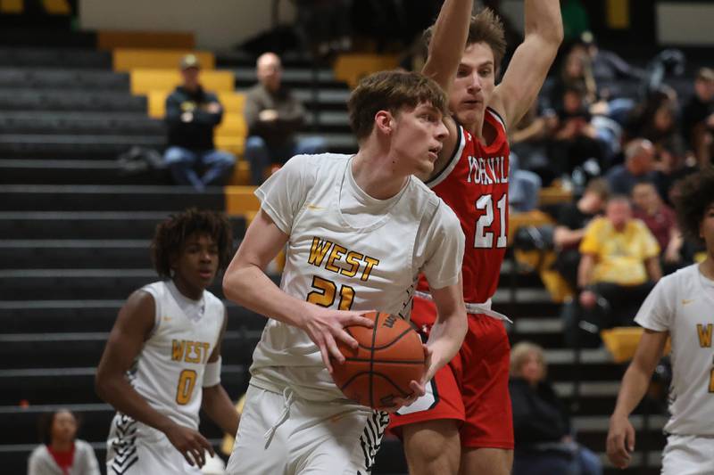 Joliet West’s Drew King looks for an outlet after the rebound against Yorkville on Friday, Jan. 5th, 2024. in Joliet.