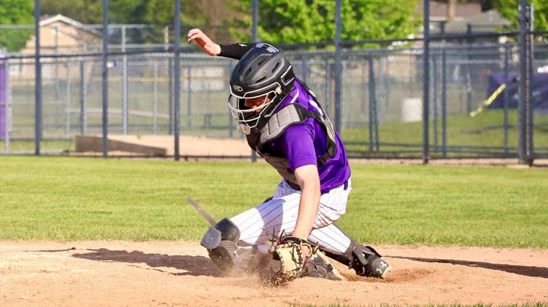 Rochelle's Luke Dickey catches the ball during the game with Marengo.