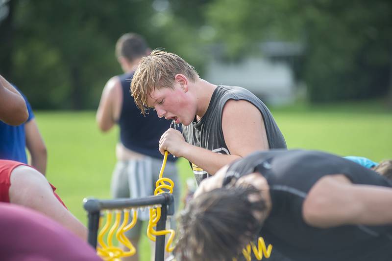 Morrison football players take a break during drills Tuesday, July 26, 2022.