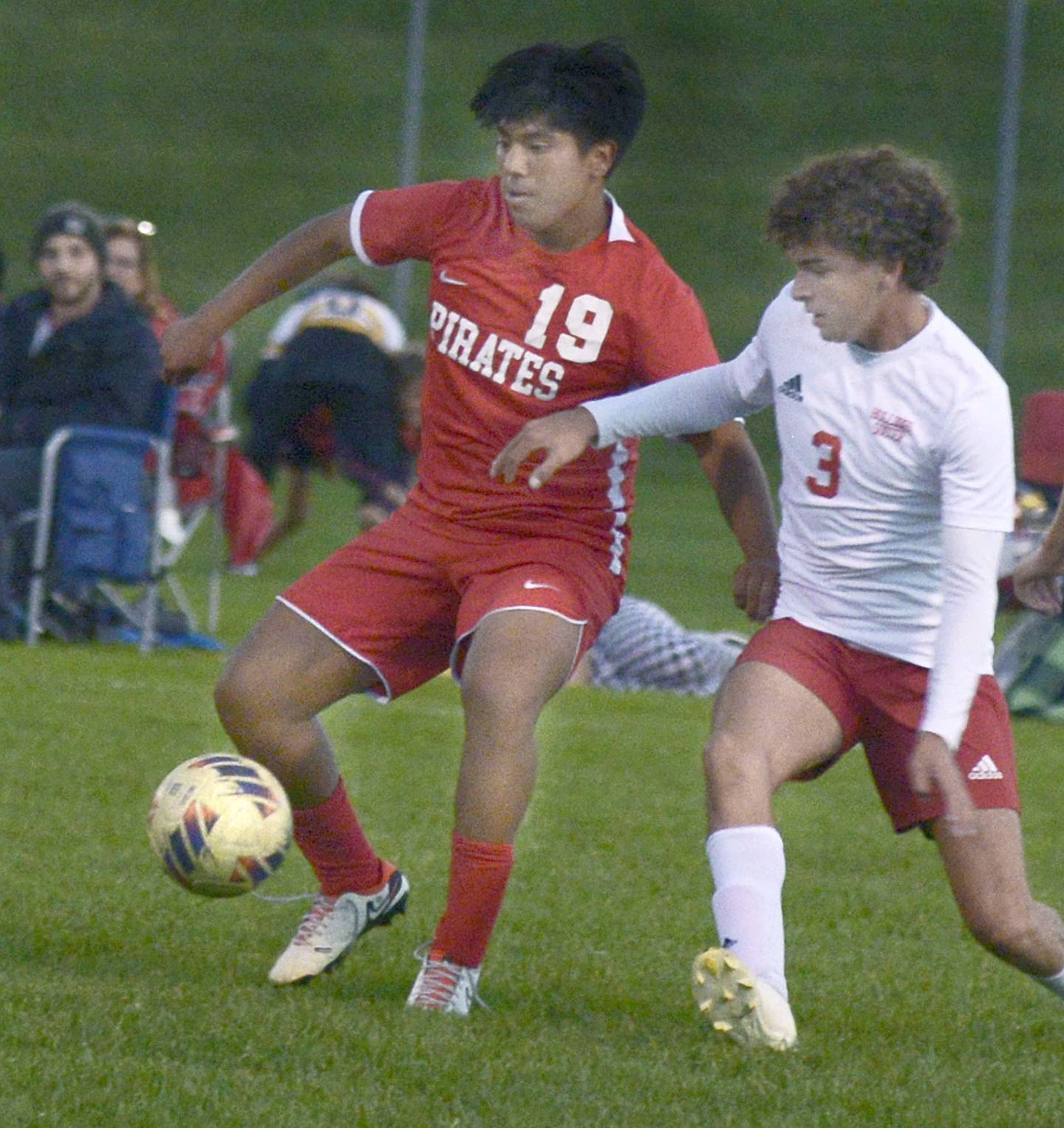 Ottawa’s Joan Gutierrez fights for control of the ball with Streator’s Moe Bacon during the first half of Tuesday's match at Ottawa.