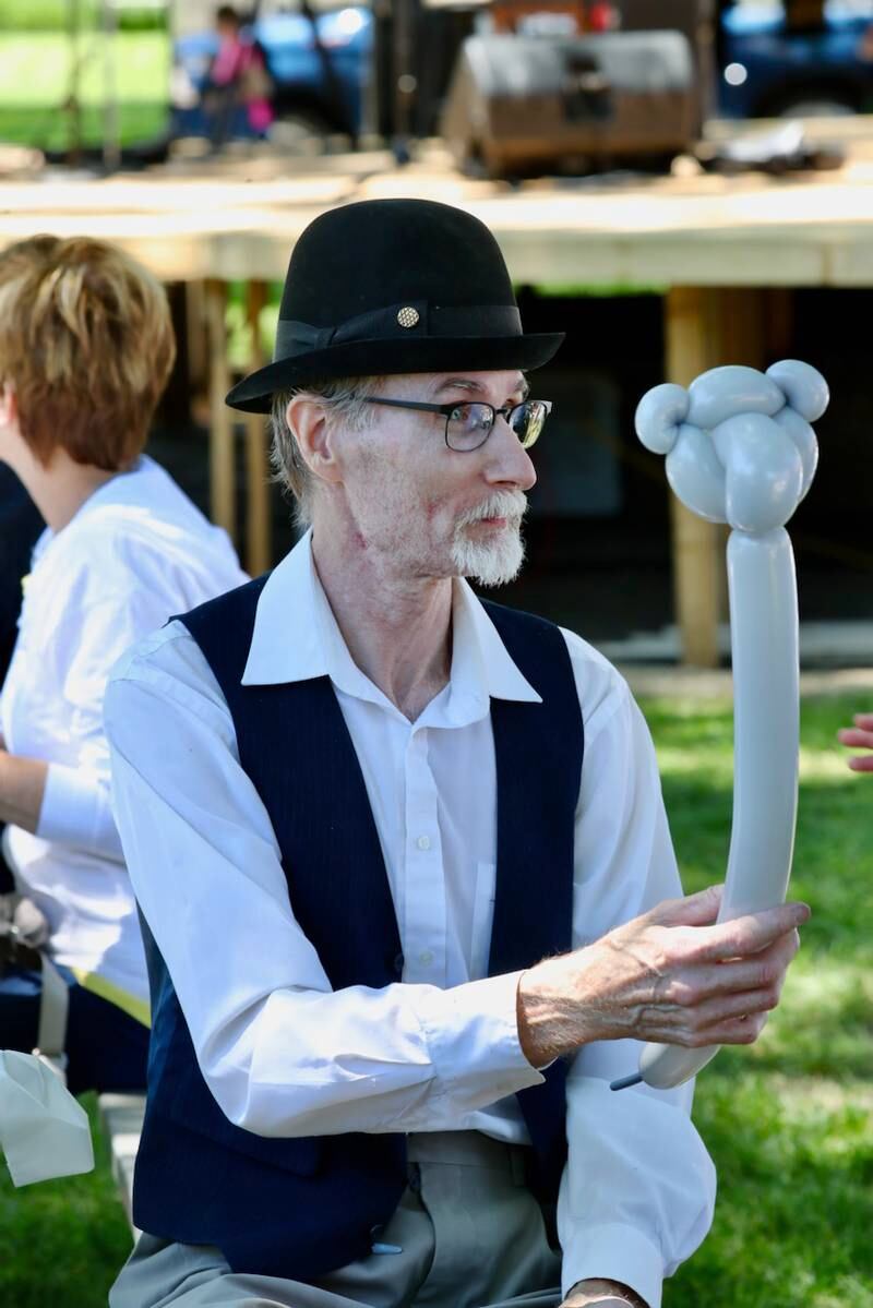 Mr. Cinnamon the Clown makes balloon figures during the Beef and Ag Days Celebration in Princeton.