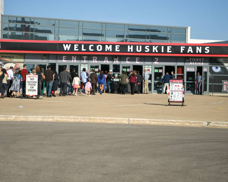 Northern Illinois University graduates and commencement goers wait in line to get into the convocation center on Saturday May 9, 2026, for the graduation ceremony in DeKalb.