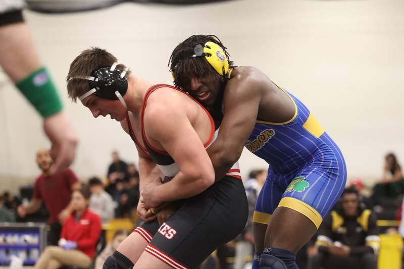 Charles Walker of Joliet Central wraps up Luke Chrisse of Yorkville in the 215-pound weight SPC Conference championship match at Joliet West on Saturday, Jan 25, 2025.