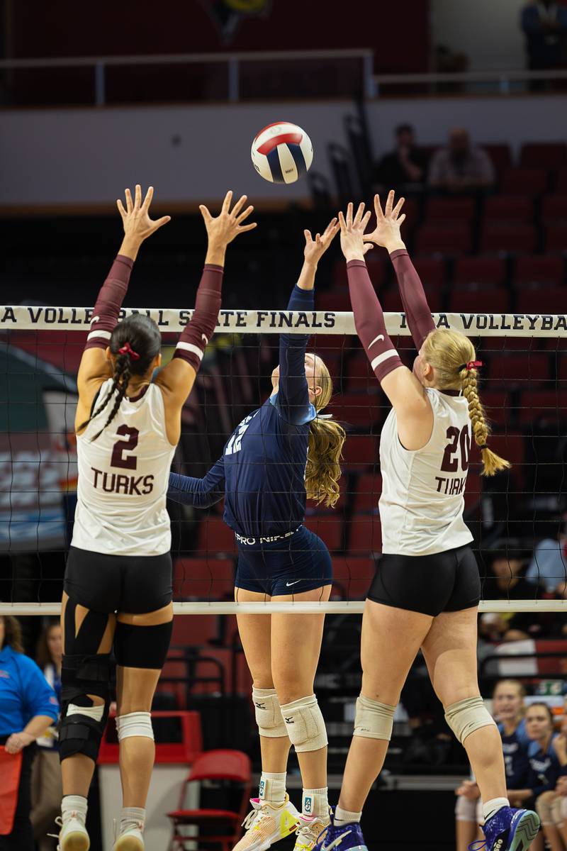 Cissna Park's Josie Neukomm tips the ball over the net under pressure during the Timberwolves' victory in two sets, 25-19, 25-20, over Tremont in the IHSA Class 1A State semifinals on Friday, Nov. 14, 2025.