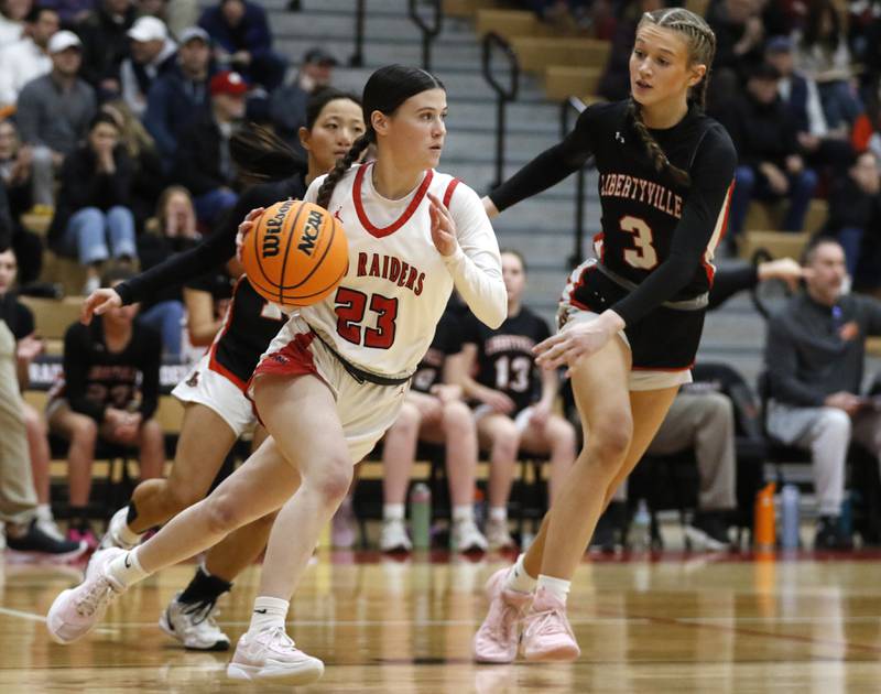 Huntley's Aubrina Adamik pushes the ball up the court against Libertyville's Sophia Swanson (left) and Lily Fisher (right) during the IHSA Class 4A Huntley Sectional Championship girls basketball game on Thursday, Feb. 27, 2025, at Huntley High School.