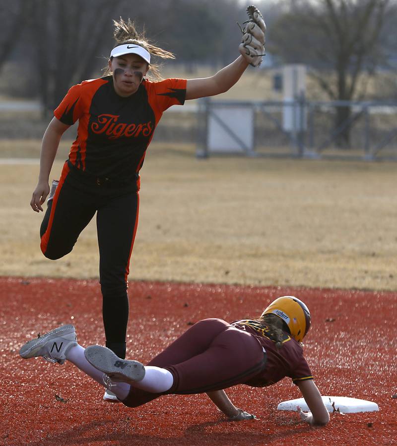 Richmond-Burton's Mia Spohr dies into second base under Crystal Lake Central's Gianna Carone after she was not able to come up with the high throw during a nonconference softball game Wednesday March 16, 2022, between Crystal Lake Central and Richmond-Burton at Lippold Park in Crystal Lake.
