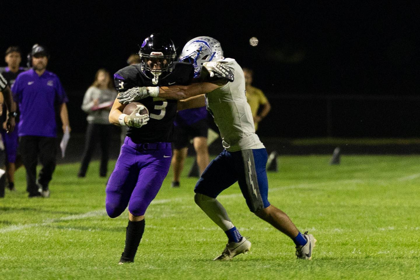 Plano's Ethan Taxis goes for yards after a catch during Friday's game with Woodstock in Plano.