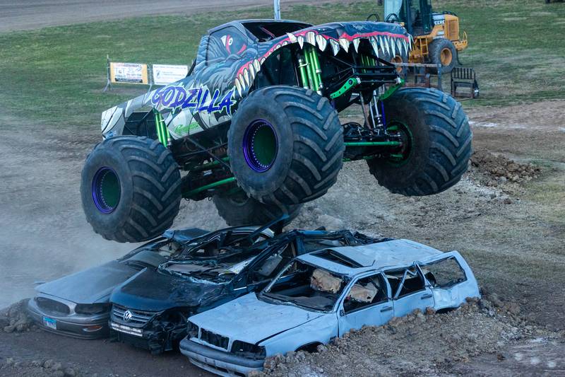Ryan Holman drives Monster Truck 'Godzilla' over 3 cars during the Monster Truck Bash on Saturday, Sept. 13, 2025 at the La Salle Speedway in La Salle.