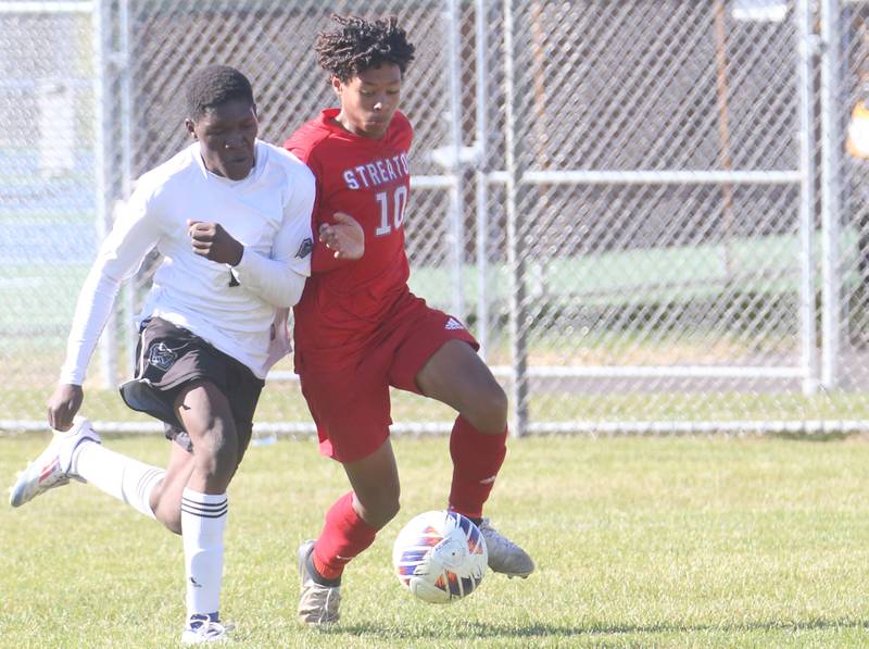 Galesburg's Obed Mbaia and Streator's Carlos Cueto go after the ball during the Class 2A Regional final on Saturday, Oct. 26, 2024 at Ottawa High School.