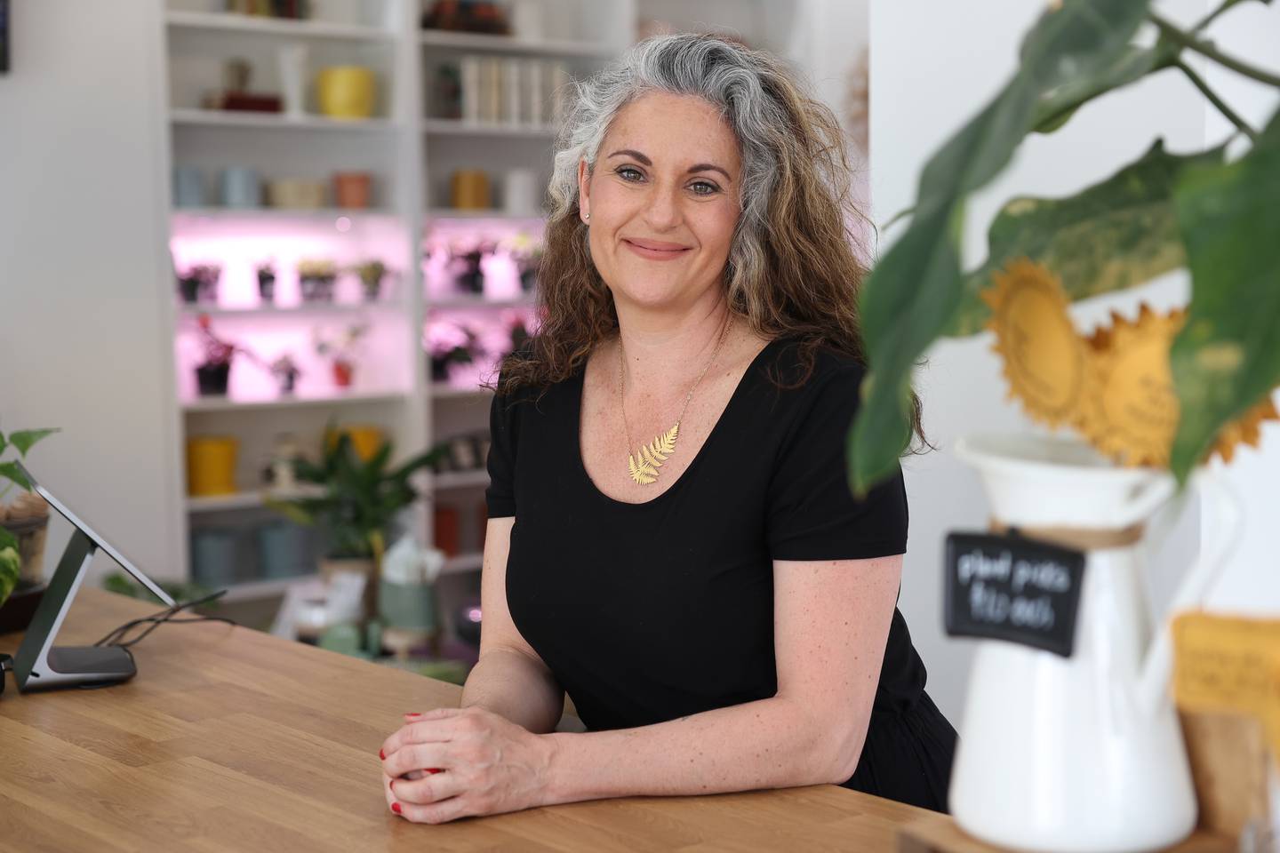 Michele Arana-Bianchi stands in her shop Internode Greenery and Home in Downtown Joliet on Thursday, April 20, 2023.