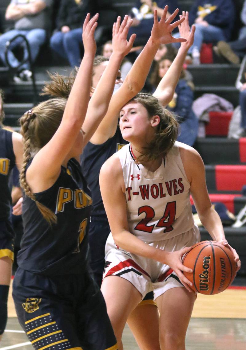 Indian Creek's Audrey Witte is stopped by two Polo defenders during their Class 1A regional game Tuesday, Feb. 15, 2022, at Indian Creek High School in Shabbona.