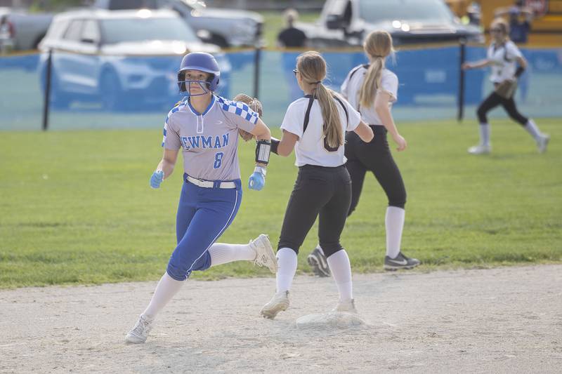 Newman’s Lucy Oetting rounds second against Putnam County Thursday, May 18, 2023.