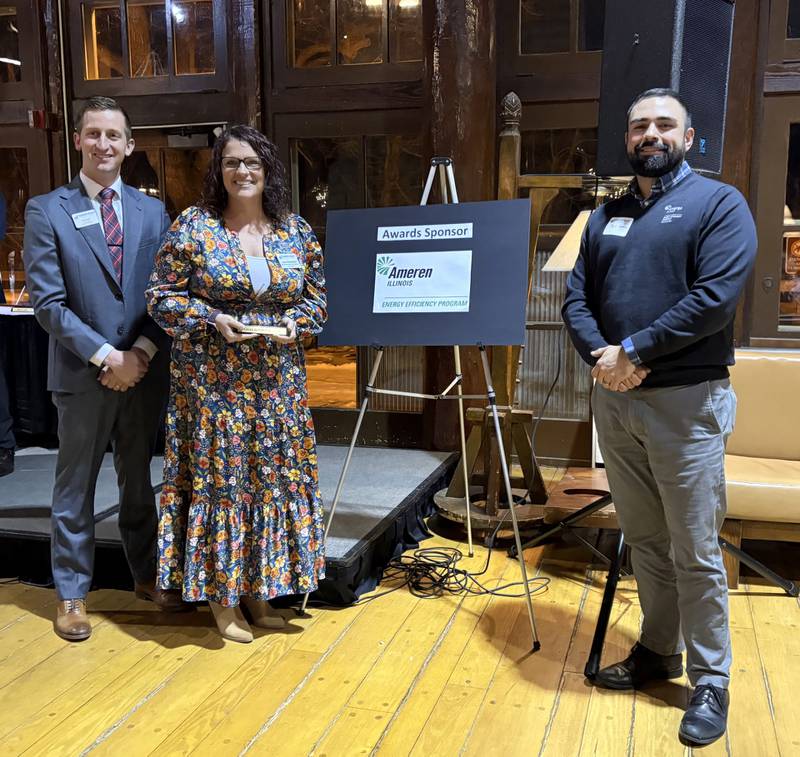 IVAC Board President Neal Knauf, Phil Lopez of Ameren, and Laura Butterfield pose after Butterfield received the Volunteer of the Year award at the Illinois Valley Area Chamber of Commerce annual dinner Wednesday.
