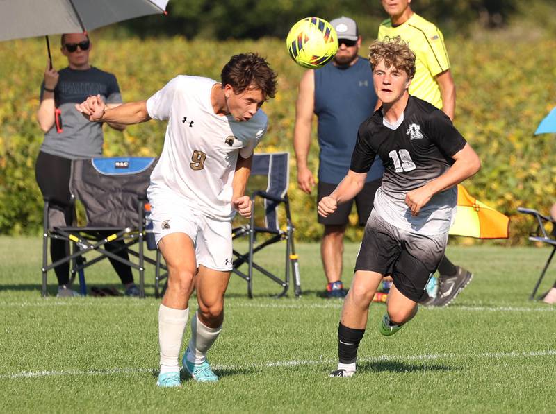 Sycamore's Chase Reyman (left) heads the ball away from Kaneland's Isaac Stoltzner during their game Wednesday, Sept. 16, 2025, at Kaneland High School in Maple Park.