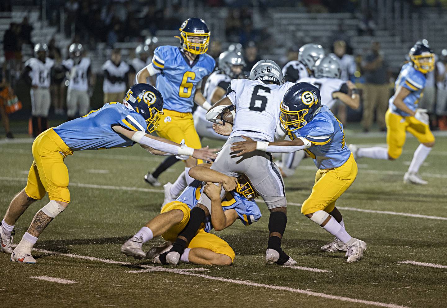 The Sterling defense stop Galesburg’s Amarie Richardson Thursday, Sept. 14, 2023 in a game at Sterling High School.
