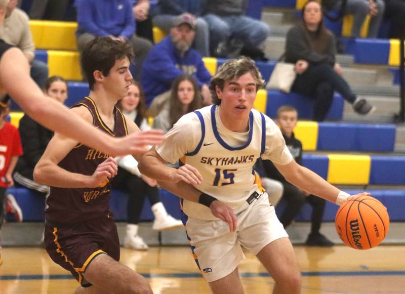 Richmond-Burton’s Dane Gardner, left, guards Johnsburg’s Ashton Stern in varsity boys basketball onTuesday, Dec. 9, 2025, at Johnsburg High School in Johnsburg.