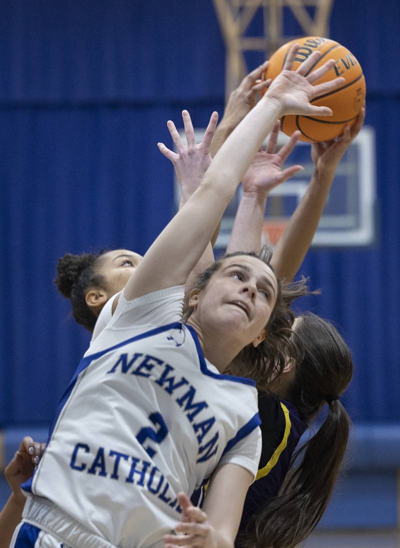 Newman’s Helen Papoccia reaches for a rebound against Mendota Thursday, Jan. 23, 2025.