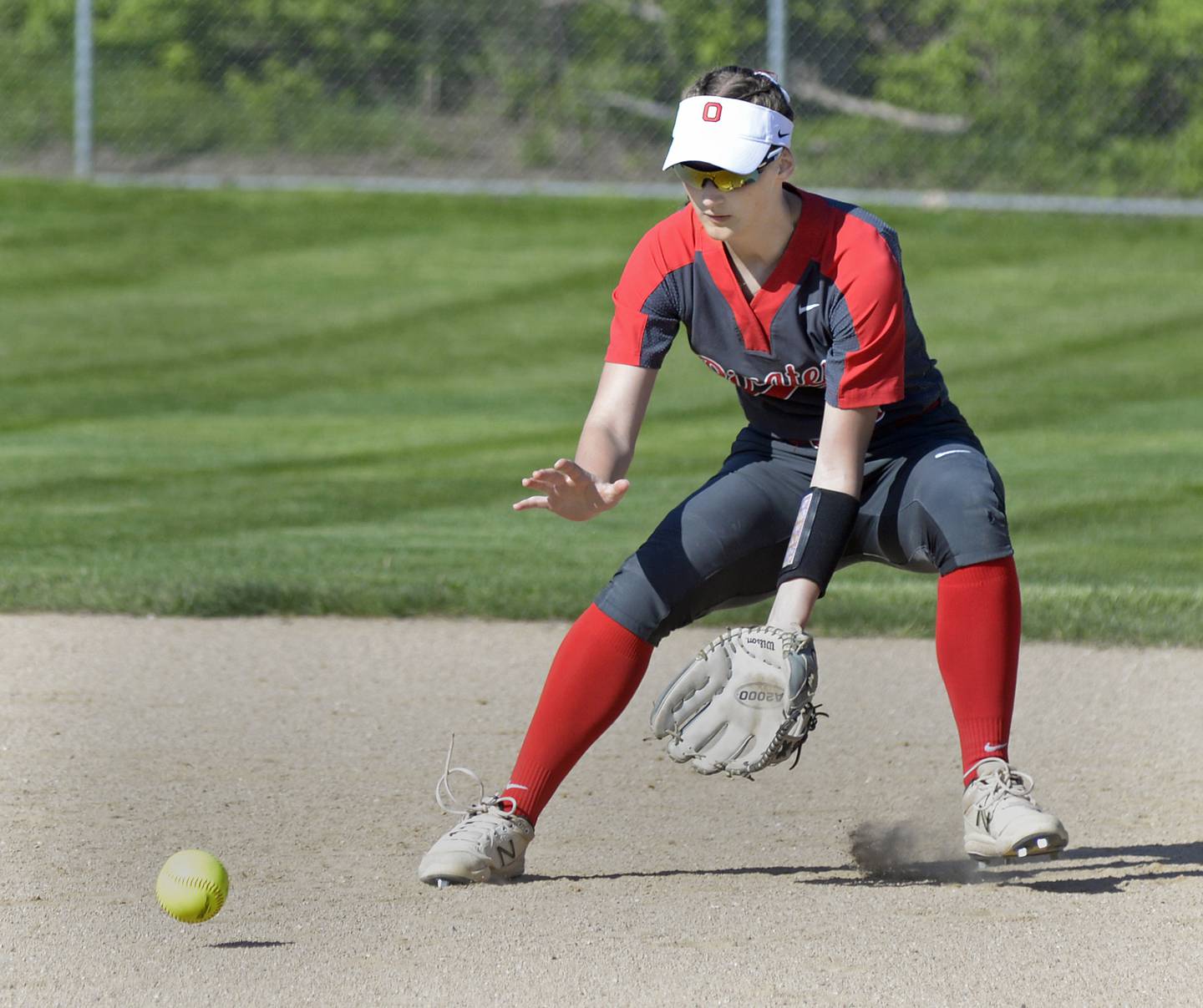 Ottawa 2nd baseman Hailey Larsen sets to scoop up a ground ball in the 1st inning Wednesday against Rochelle at Ottawa.
