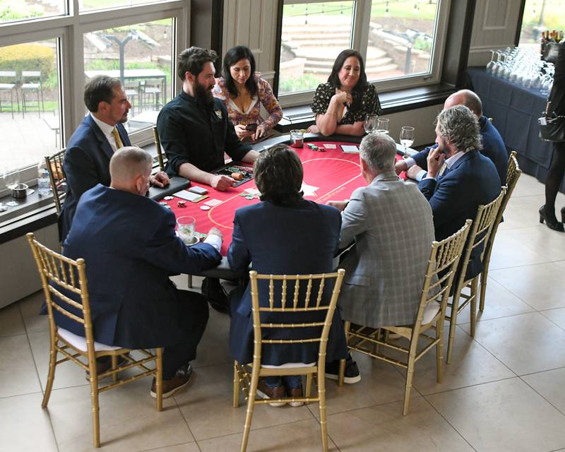 Attendees play blackjack at the Monte Carlo-themed Charlemagne Awards, hosted by the St. Charles Area Chamber of Commerce on Friday May 1, 2026.