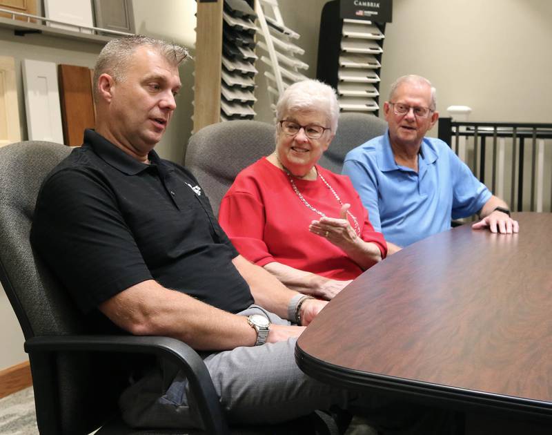 Greg Spears, (left) Ken Spears Construction president, talks with his parents and company founders, Ken and Kathy Spears Friday, Aug 22, 2025, at the business in DeKalb. The company is celebrating its 50th anniversary this year.