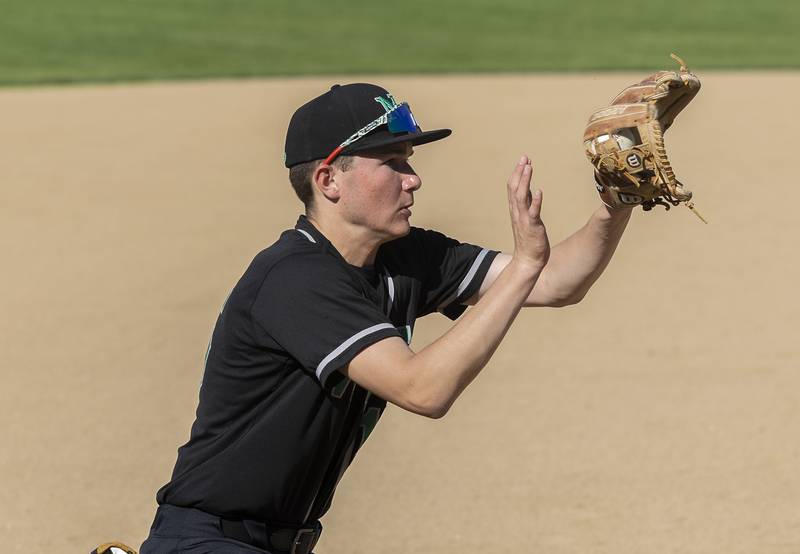 North Boone’s Brayden Sunden fields a ball against Dixon Tuesday, May 6, 2025.