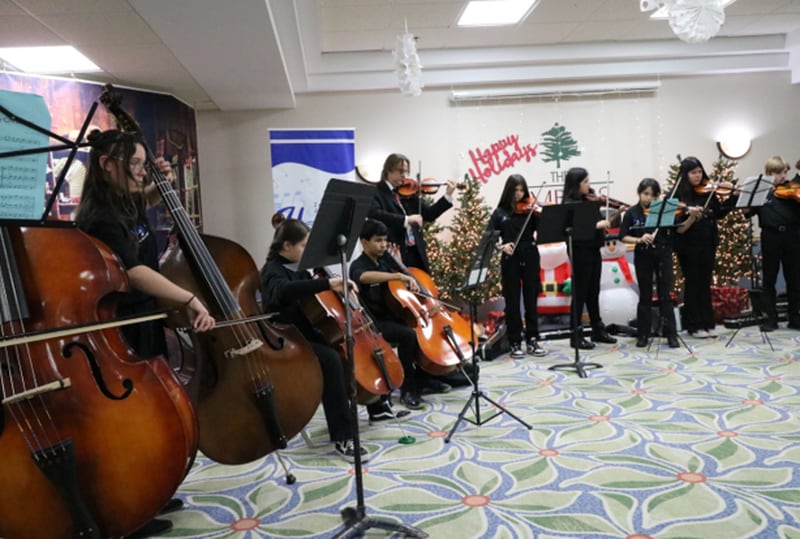 Select Joliet area locations enjoyed live holiday music on Dec. 15 performed by 18 Hufford Junior High orchestra students, including The Timbers of Shorewood (pictured).