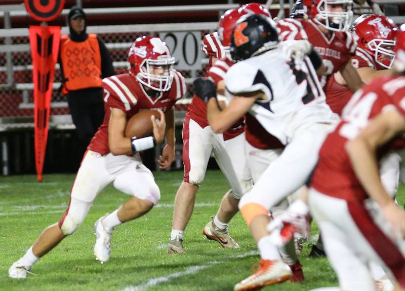 Hall quarterback Dylan Glynn runs the ball on a carry against Kewanee on Friday, Sept. 27, 2024 at Richard Nesti Stadium.