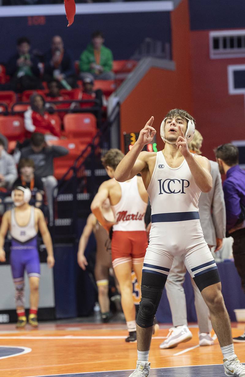 IC Catholic’s Deven Casey celebrates his win over Civic Memorial’s Bradley Ruckman in the 132 pound weight class of the 2A state individual wrestling finals Saturday, Feb. 22, 2025, at State Farm Center in Champaign.