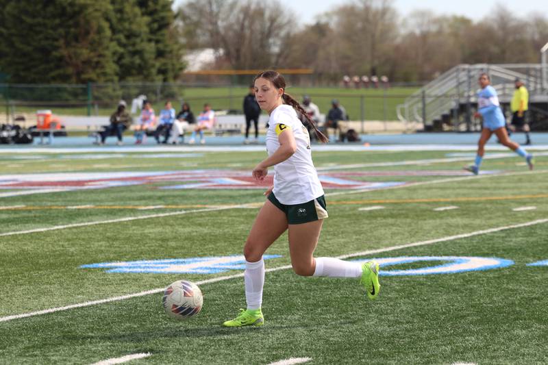 Bishop McNamara's Ava Brockell makes an offensive rum during the Fightin' Irish's 8-0 loss to Kankakee in the final All-City match on Saturday, April 11, 2026.