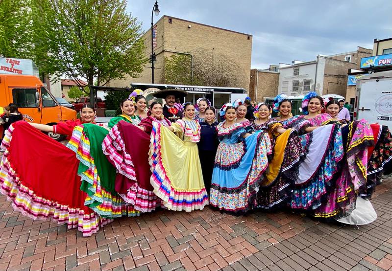 Dancers with Northern Illinois University's Ballet Folklórico Aztlán pose before performing on Sunday, May 4, 2025, in the Frank Van Buer Plaza in downtown DeKalb for the city's annual Cinco de Mayo Celebration.