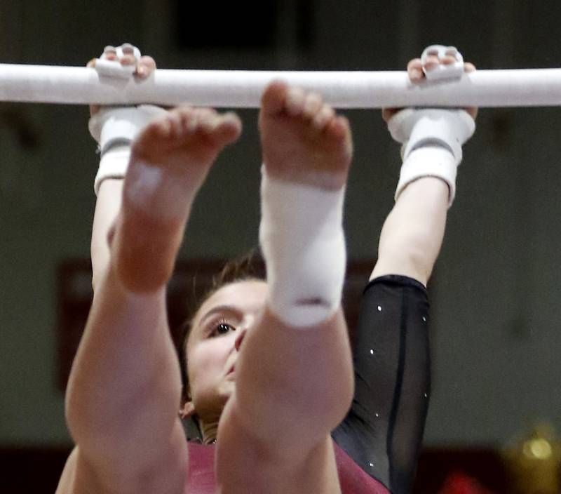 Prairie Ridge’s Tess Morton competes on the uneven parallel bars  during the IHSA Mundelein Gymnastics Sectional on Feb. 13, 2025, at Mundelein High School.
